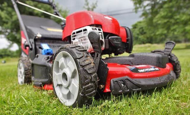 Self-propelled lawn mower weight